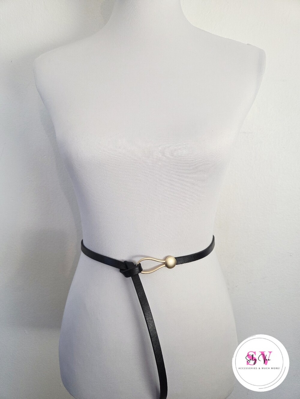 Thin black belt with gold circular buckle